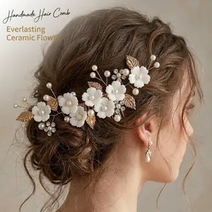 Elegant handmade white ceramic flower bridal hair comb with pearls and rhinestones