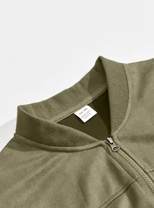 Close-up of olive green men's faux suede jacket collar and XXL size tag