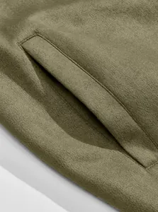 Close-up detail of the side pocket and soft suede fabric texture on a men's jacket.