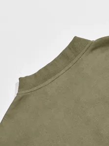 Close-up of olive green suede knit jacket showing ribbed mock neck collar detail