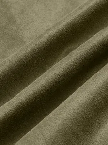 Close-up detail of olive green suede knitted fabric with soft texture and folds