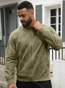 Man wearing a slim fit olive green suede zip-up bomber jacket in urban setting