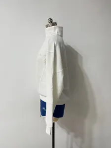 Detailed side profile of a white half-zip long sleeve sweatshirt on a mannequin