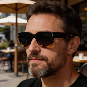 Close-up side view of a man wearing stylish retro square tortoise-shell sunglasses