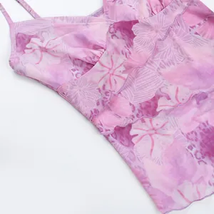 Close-up of pink floral print mesh camisole showing ruffle detail and sheer fabric texture