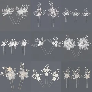 Handmade bridal hairpins with crystals and pearls in various floral and leaf designs.