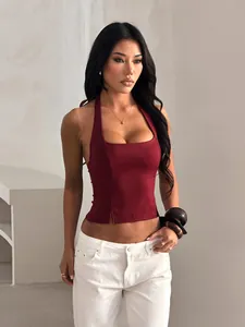Detail of slim fit wine red halter neck tank top with split hem, 2025 summer style.