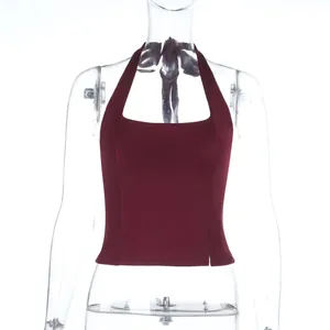 Close-up detail of burgundy halter neck tank top featuring slim fit and side slits