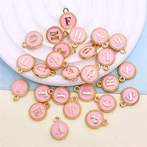 26 piece set of pink enamel alphabet charms with gold finish for DIY jewelry making