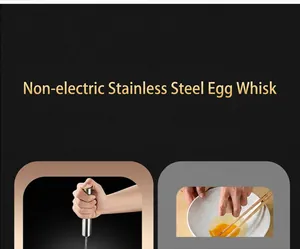 Close-up of hand-held stainless steel semi-automatic whisk for baking and mixing