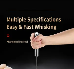 Close-up detail of a 316 stainless steel semi-automatic egg whisk held by hand