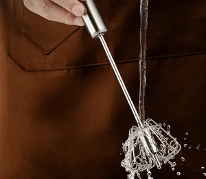 Detail view of 316 stainless steel semi-automatic whisk being rinsed under water