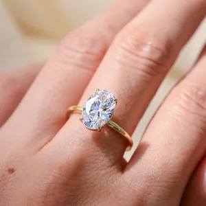 Detailed macro view of an elegant oval-cut cubic zirconia ring set on a gold-plated silver band