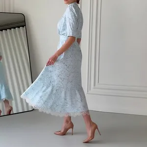 Elegant light blue floral midi dress with delicate white lace trim and high waist