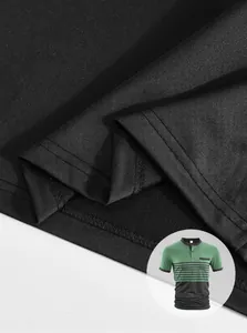 Detail view showing the high-quality fabric texture and hem stitching of the black polo shirt