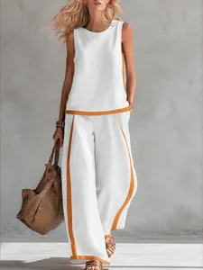 Fashionable summer two-piece sleeveless white set with orange piping and wide-leg pants