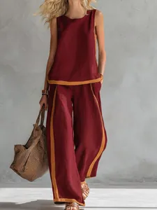 Stylish women's two-piece set featuring a sleeveless top and wide-leg pants in burgundy and yellow