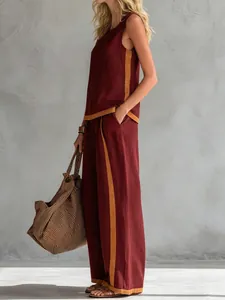 Burgundy sleeveless top and wide-leg pants set with yellow side stripes
