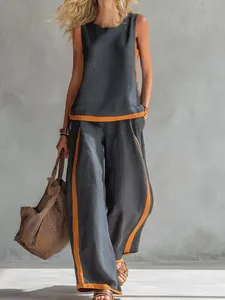 Detail of women's sleeveless contrast linen set in grey and orange for summer