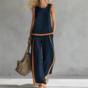 Chic sleeveless navy and orange color-block wide-leg pants set for summer leisure.