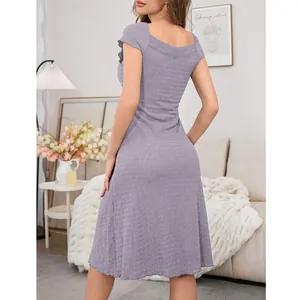 Back view of a lavender textured dress with lace trim in a home setting