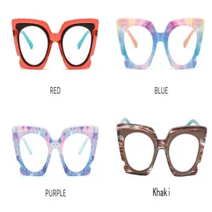 Detailed view of colorful oversized butterfly glasses frames in four vibrant patterns
