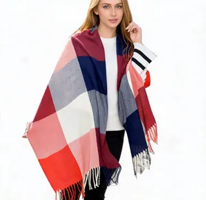 Elegant cashmere-like plaid shawl scarf with tassels on model against white background
