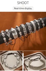 Detailed macro view of vintage Tibetan ethnic style adjustable woven bracelets with fish motifs