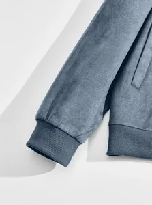 Detailed close-up showing the high-quality blue suede fabric and ribbed cuff texture