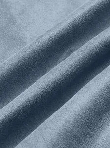 Detailed macro view showing the soft and fine texture of the blue suede fabric material