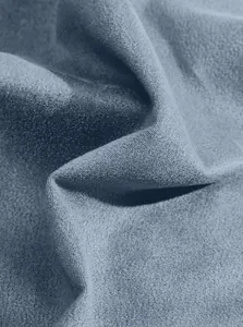 Macro view of high-quality blue suede fabric texture for men's slim fit jacket.