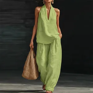 Fashionable lime green sleeveless halter top and wide-leg pants set for summer look