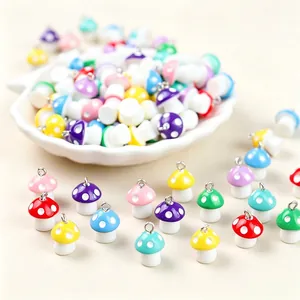 High-angle close-up of colorful resin mushroom charms for DIY jewelry accessories