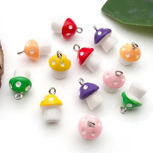 Assorted colorful resin mushroom charms for DIY jewelry making and handmade crafts.
