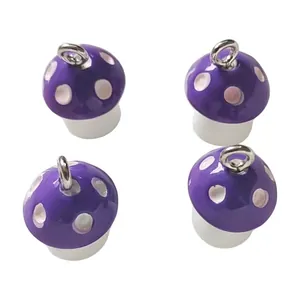 Set of four purple resin mushroom charms with silver eyelets for DIY jewelry making.