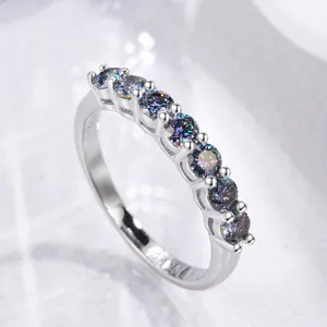 Elegant S925 silver seven-stone row ring featuring brilliant iridescent moissanite gems