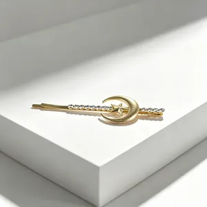 Detailed view of the elegant golden moon and star hair clip with sparkling crystals.