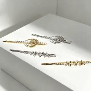 Elegant star and moon rhinestone bobby pins set in polished gold and silver finishes