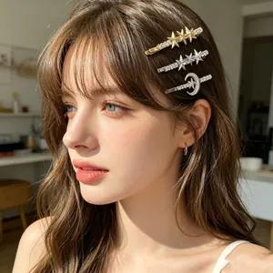 Close-up detail of moon and star rhinestone hair clips worn by a model in soft light