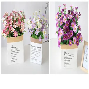 Close-up detail of colorful artificial daisy bouquets in rustic kraft paper bag planters