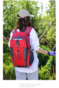 Durable outdoor hiking backpack shown being worn by a person in a natural forest setting