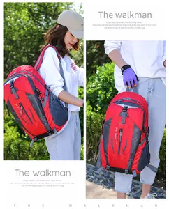 Detail view of a red large capacity outdoor mountaineering backpack carried by model