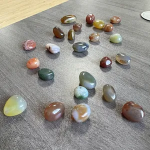 Detail shot of assorted polished natural pebbles for home decor and stone blind boxes