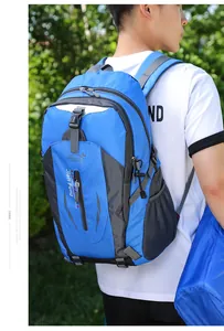 Blue large capacity outdoor hiking backpack with padded straps shown on a model