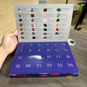 Open Christmas advent calendar box featuring 24 different natural gemstones and minerals