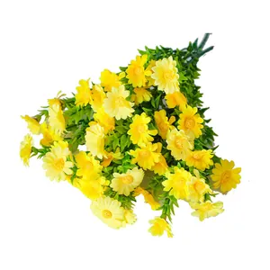 Vibrant yellow artificial daisy bouquet with realistic green leaves for home decor