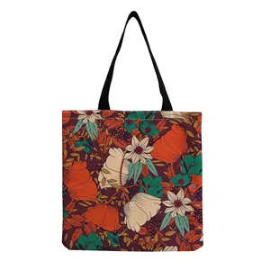 Detail showing the intricate vibrant floral pattern on the textured fabric of this tote bag