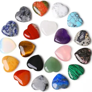 Assorted heart-shaped natural healing crystal stones in various colors and textures