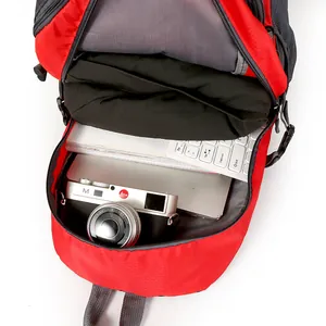 Close-up view of a red travel backpack interior showing large storage capacity.
