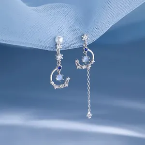 Elegant asymmetrical 925 sterling silver moon and star earrings with blue moonstone tassels